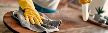 All 1 Service day porter performing facility maintenance and cleaning tasks at a commercial property to maintain a clean and professional environment.
